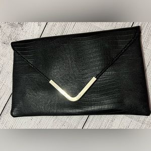 Small elegant handbag with optional silver chain for hands free continence.
